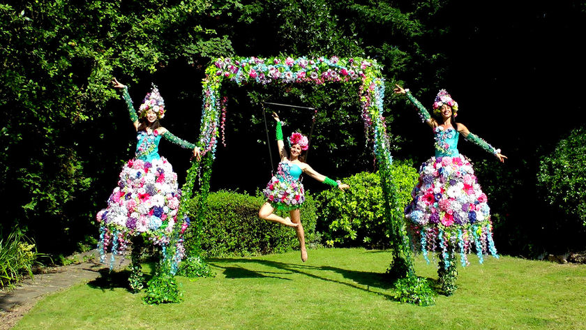 Floral garden aerial rig and matching floral stilt walkers promo